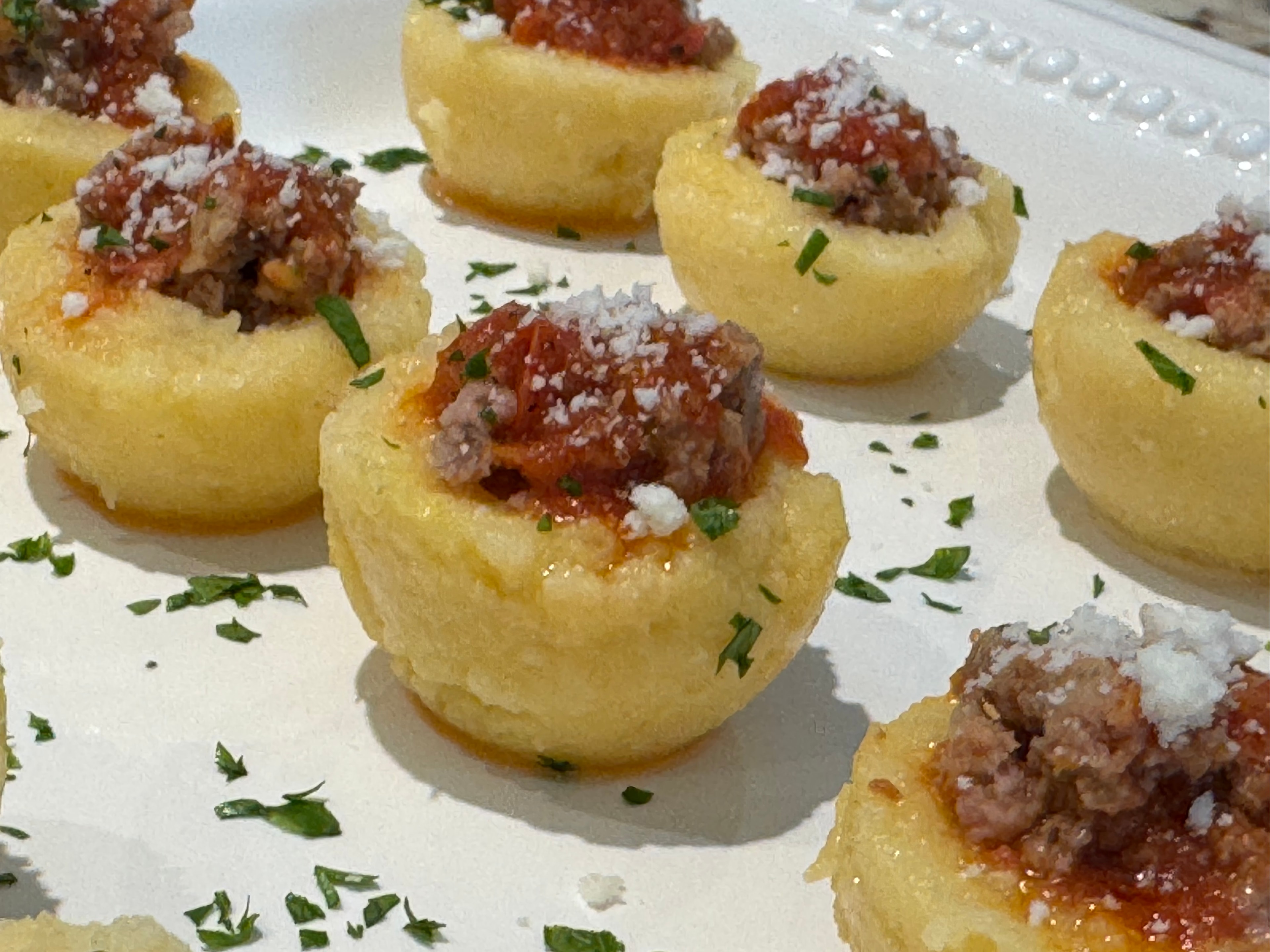 Potato rounds topped with braised beef bites